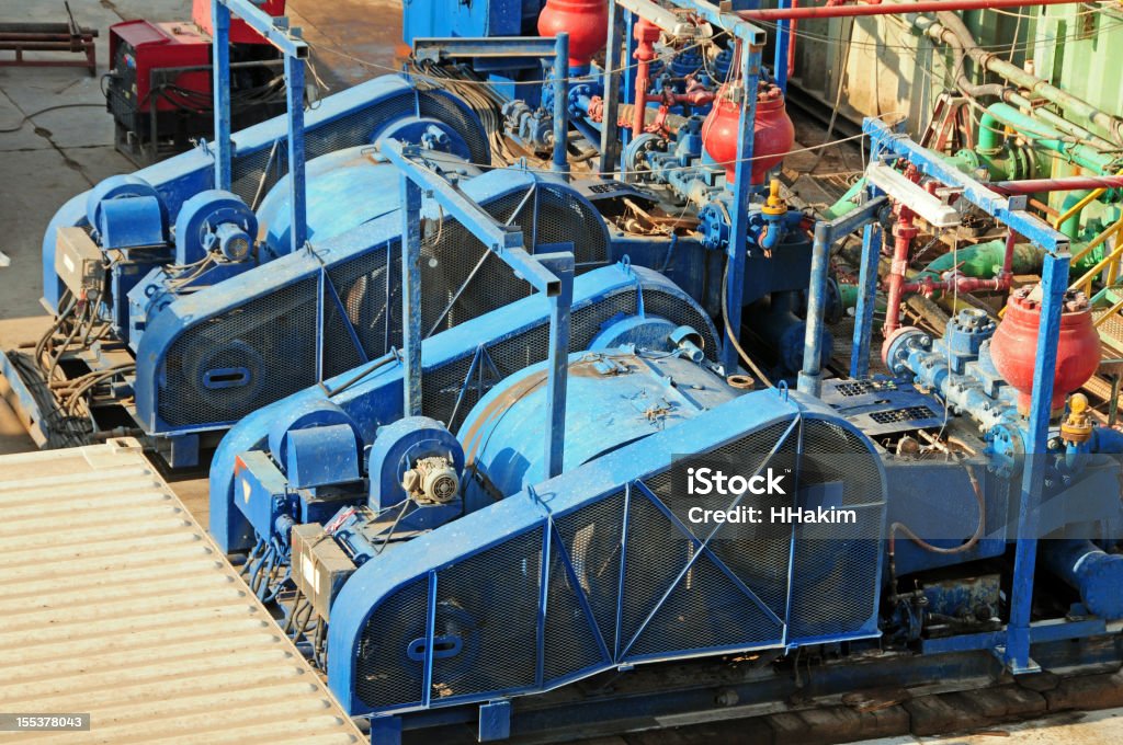 Oil & Gas Industry - Mud Pumps A mud pump is a reciprocating piston/plunger device designed to circulate drilling fluid under high pressure (up to 7500 PSI) down the drill string and back up the annulus. Drilling Rig Stock Photo