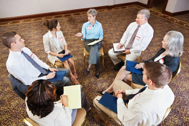 istock Group of people talking together in a support circle 155378235