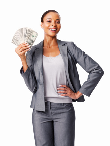 Young African American businesswoman holding American currency. Vertical shot. Isolated on white.