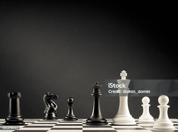 Check Move Black And White Chess Pieces On Chess Board Stock Photo - Download Image Now