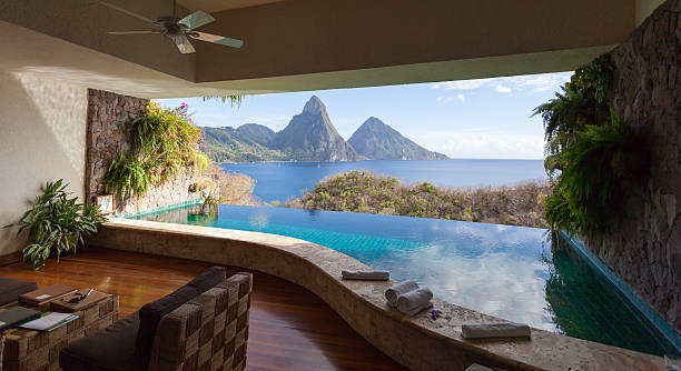 View of St. Lucian Twin Pitons from Jade Mountain The World Heritage Petit Piton framed by  beautiful infinity-pool. View from the famous resort Jade Mountain. caribbean culture stock pictures, royalty-free photos & images
