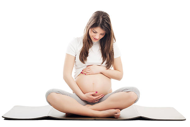 pregnant woman relaxing - pregnant isolated on white stockfoto's en -beelden