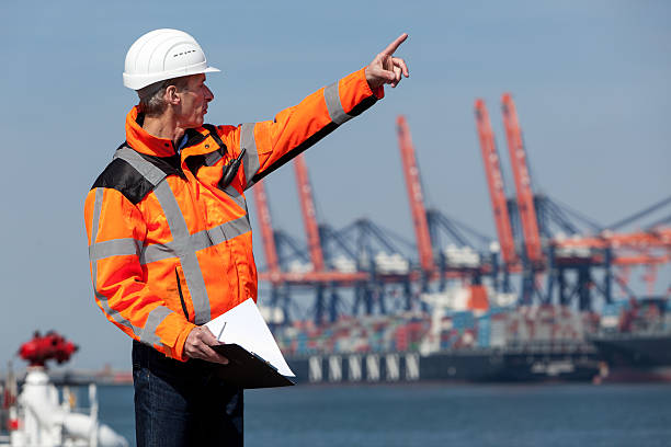 dockworker ギブ指示書 - engineer environment orange manual worker ストックフォトと画像
