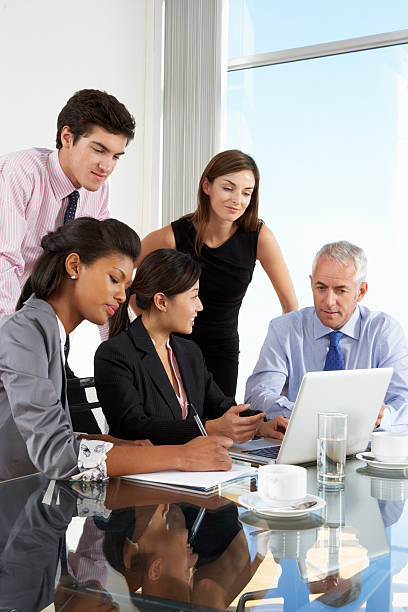 istock Office workers taking notes and listening in meeting 155378831