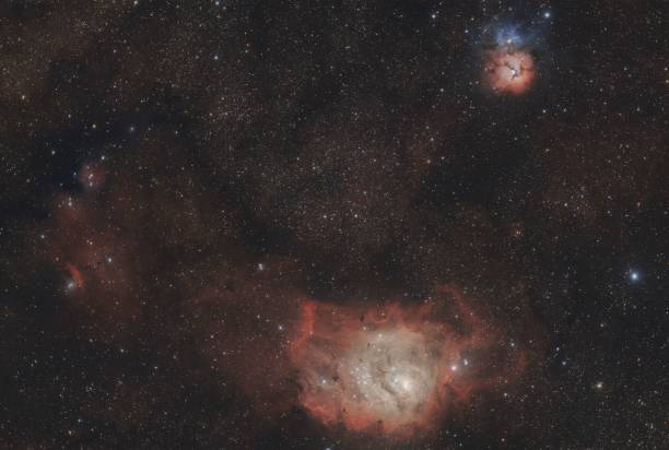 istock Breathtaking night sky with Lagoon, Trifid and Chinese Dragon Nebula 1553788501