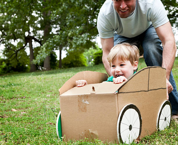 istock Little Boy in a Cardboard Car 155378908