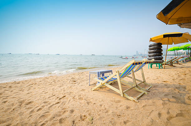 Beach chairs on perfect tropical white sand beach  .