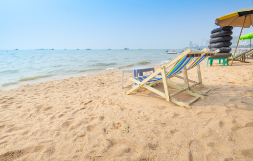 Beach chairs on perfect tropical white sand beach  .