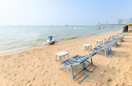 Beach chairs on perfect tropical white sand beach  .