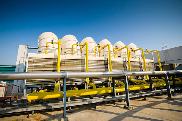 Sets of cooling towers in conditioning systems Sets of cooling towers in conditioning systems at office building , chiller hvac equipment photos stock pictures, royalty-free photos & images