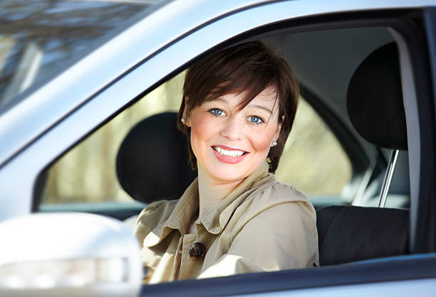 istock Attraktive young woman in her car 155380381