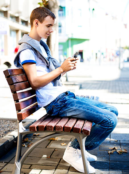 istock Teenager with mobile phone 155380438