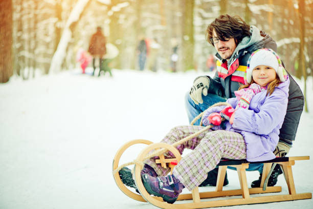 istock Father and daughter in a winter park 155380537