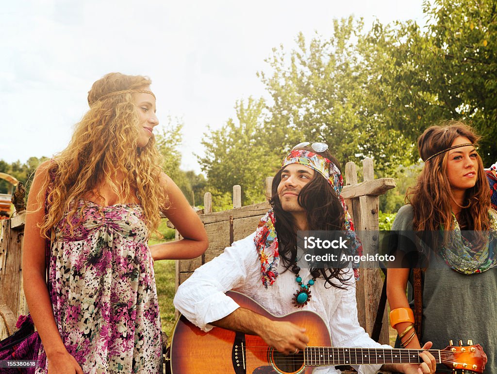 Group Of Hippie Singing In Countryside Stock Photo - Download Image Now ...