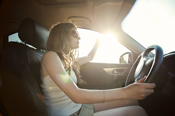 istock Young woman driving a car. 155380940