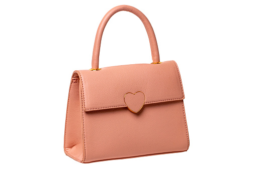 Stylish women's handbag. A fashionable female pink luxury handbag isolated on white. Fashionable womans accessories. Clipping path. Advertising.