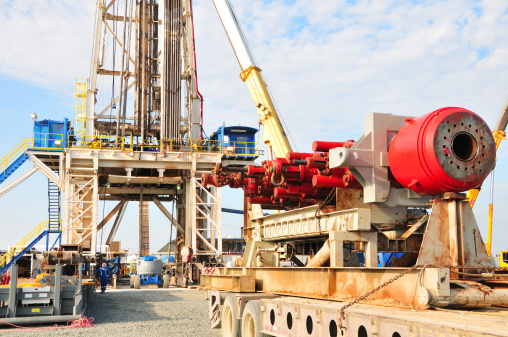 A drilling rig is preparing to install the Blowout Preventor (BOP) stack. The BOP stack is one of the critical components on a drilling rig to prevent blowout.