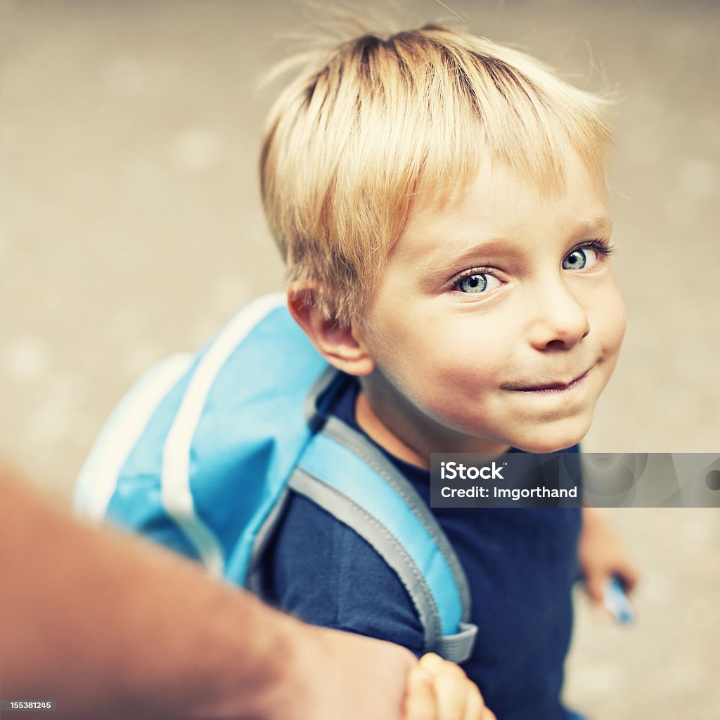 Walking son to school Little boy with backpack on his way to school / kindergarten. Child Stock Photo