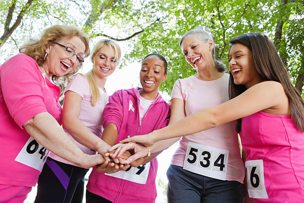 istock Diverse group of women showing teamwork during charity race 155381296