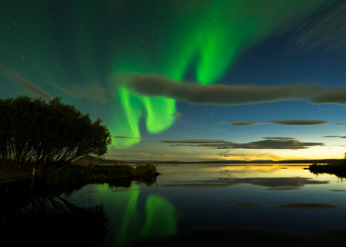 aurora borealis on iceland, mirrored sky on lake myvatn, some ISO-noise