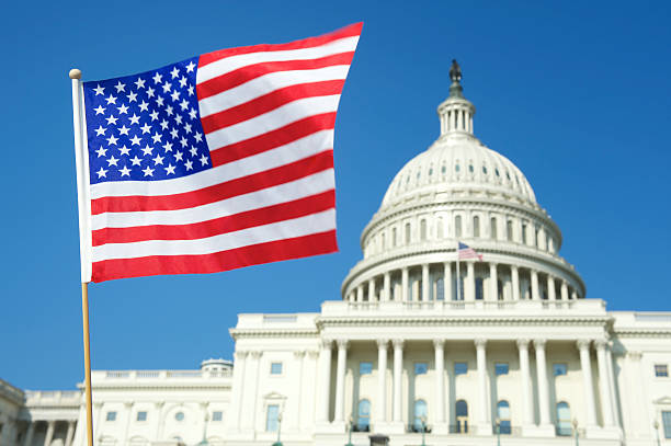 istock American Flag Flies at Capitol Building Washington DC 155381759