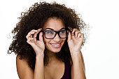 Woman putting on eyeglasses