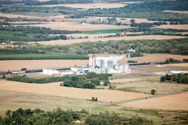 Ethanol Biorefinery Fall Aerial with Farmland An aerial view of an Ethanol plant, surrounded by farms and cornfields. Shot from the open window of a small airplane on an early autumn day.   http://www.banksphotos.com/LightboxBanners/Aerial.jpg http://www.banksphotos.com/LightboxBanners/AgFarming.jpg corn biodiesel crop corn crop stock pictures, royalty-free photos & images