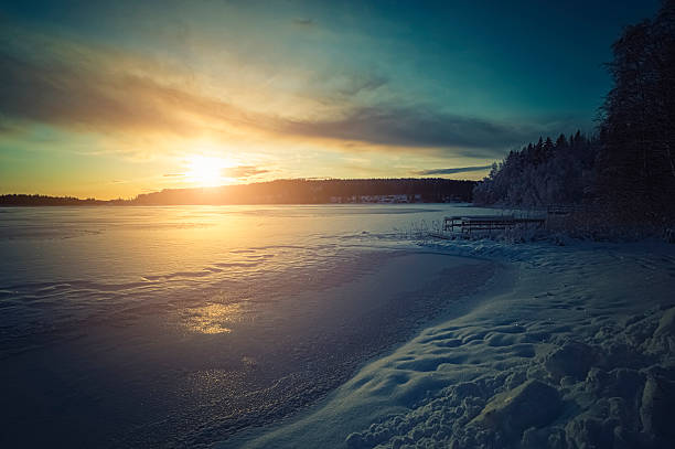 istock Sunset on a frozen lake In Sweden during Winter 155382104