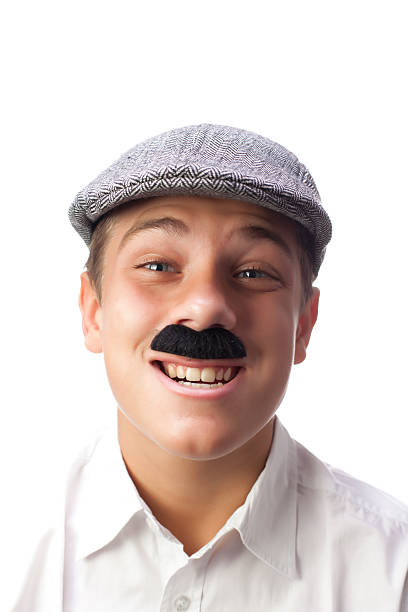 Young Italian Boy Making a Weird Expression with Mustaches stock photo