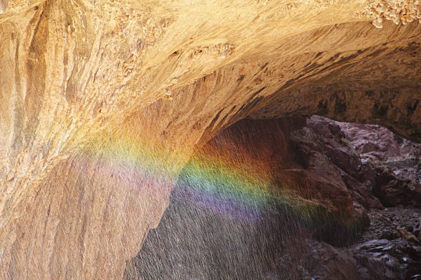 Tonto Natural Bridge is a natural arch in Arizona, USA, that is believed to be the largest natural travertine bridge in the world. Precipitation began seeping underground through fractures and weak points in the rock, resulting in limestone aquifers. Springs emerged as a result of these aquifers, carrying the dissolved limestone and depositing calcium carbonate to form a travertine dam. The waters of Pine Creek then eroded through the travertine and formed the Natural Bridge.