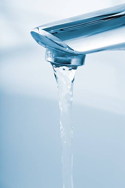 istock running water from bathroom faucet 155382937