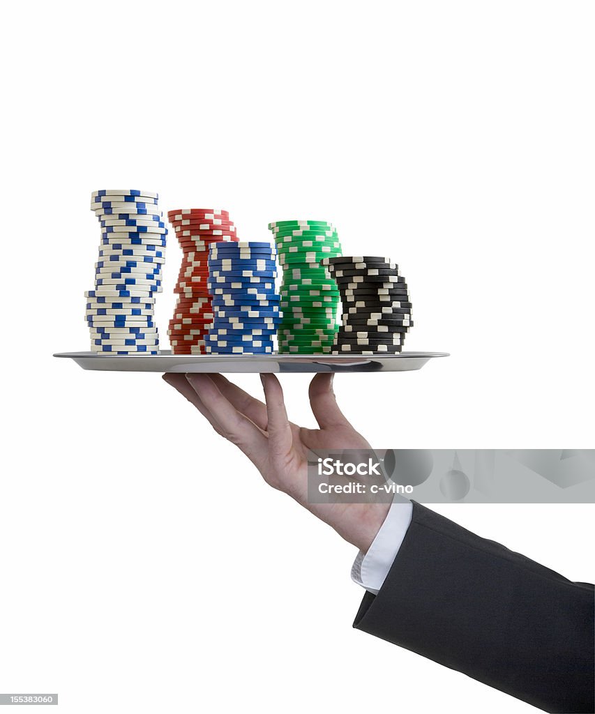 Silver tray with butler's hand and poker chips A butler serving with a silver tray Poker chips Gambling Chip Stock Photo