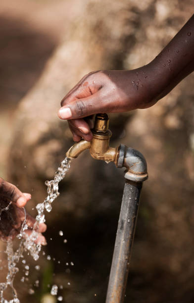 istock Hands of children with faucet 155383104