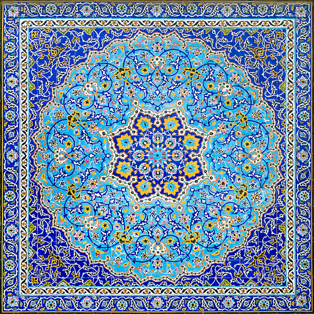 Iranian Tile Decor Geometrical islamic and  arabic style full frame tile tableau. A mosaic of mostly blue tiles with a square and circle pattern. A symmetrical wall decoration in the Golestan Palace in Tehran, Iran. The center looks like a flower. islamic architecture stock pictures, royalty-free photos & images