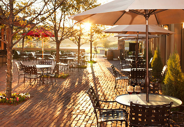Lovely summer patio setting in restaurant.  parasol photos stock pictures, royalty-free photos & images