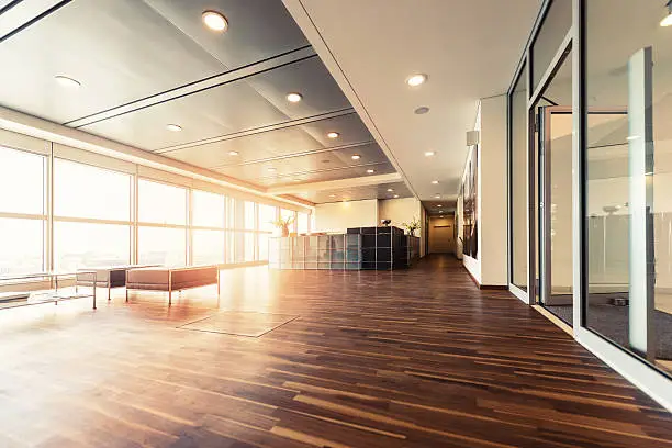 Photo of Office reception with wood floors and window wall