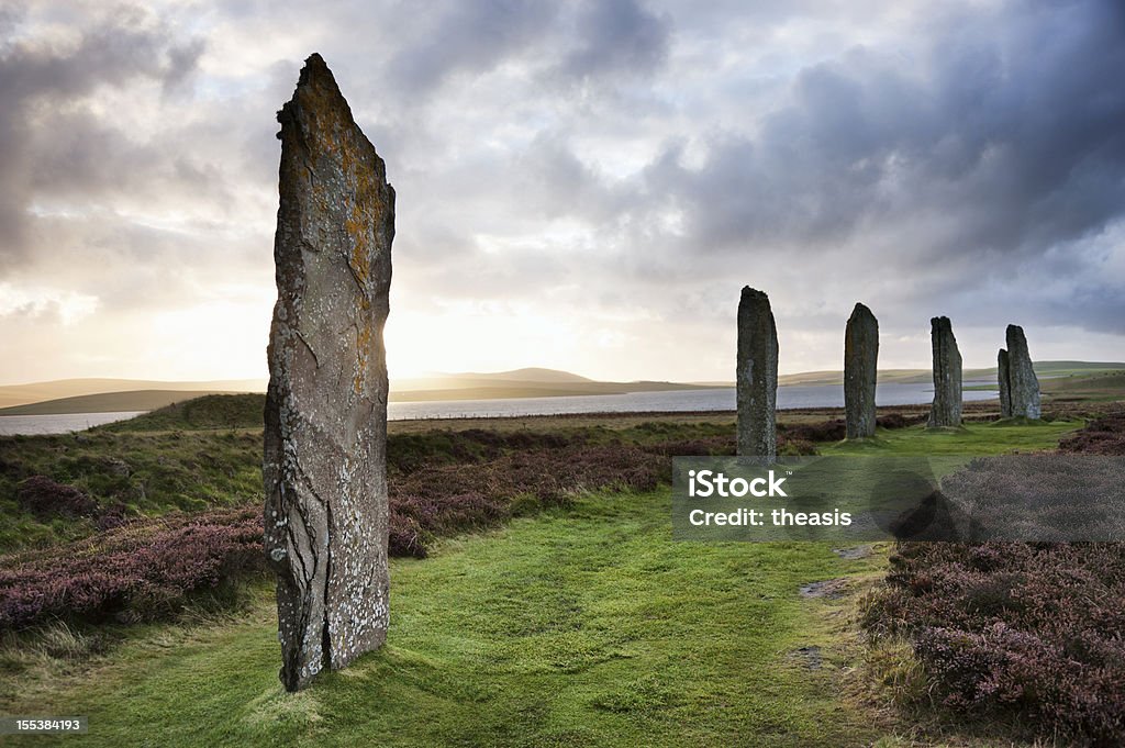 Ring Of Brodgar, Orkney The ancient standing stones of the Ring of Brodgar in the Orkney Islands off the north coast of Scotland, in the evening just at sunset. This monument in the heart of the Neolithic Orkney World Heritage Site is believed to have been built between 4000 and 4500 years ago. Originally built with sixty stones in a circle over 100 metres (over 100 yards) across, fewer than half of the stones still stand. The tallest of the stones is a little over 4.5 metres (15 feet) tall. Orkney Islands Stock Photo