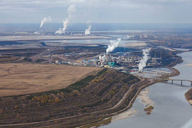 Oilsands Refineries Oil refineries along the Athabasca River in Alberta's Oilsands. oilsands stock pictures, royalty-free photos & images