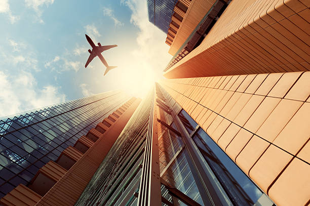 istock Futuristic office buildings with a airplane silhouette 155384858