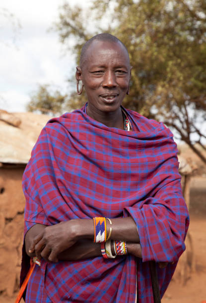 istock Masai man smiling in front of his hut. 155385005