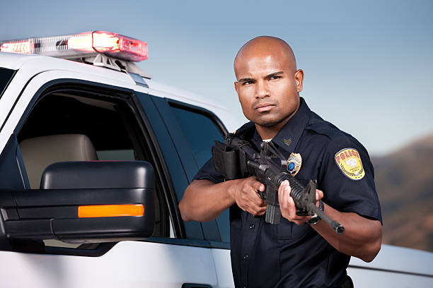 istock Black Police Officer with Assault Rifle 155385127