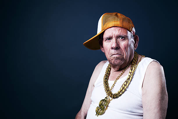 Old School grandfather Grandfather with a cap and golden chains necklace photos stock pictures, royalty-free photos & images