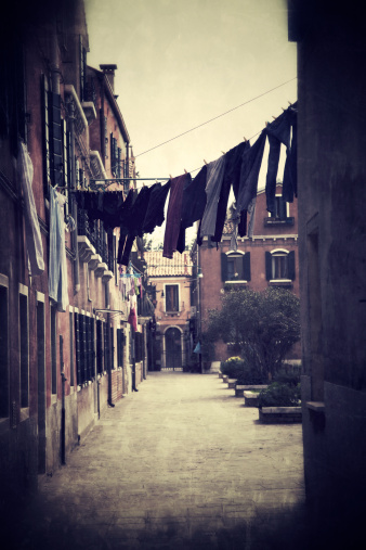 Cloths hangouted in an alley to Burano in a rainy day. Venice, Italy.\u2028http://www.massimomerlini.it/is/venice.jpg\u2028http://www.massimomerlini.it/is/venicecarnival.jpg