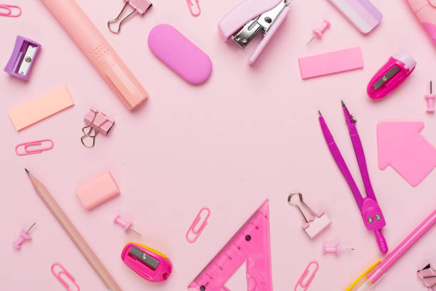 istock Pink school stationery on color backgroung, top view 1553852317