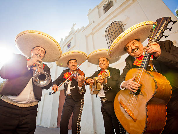 Mariachi Band Group of four Musicians playing Mariachi music cinco de mayo stock pictures, royalty-free photos & images