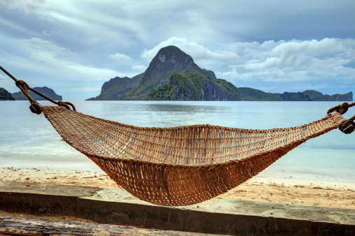 Hammock on a sandy beach, El Nido, Palawan island, Philippines