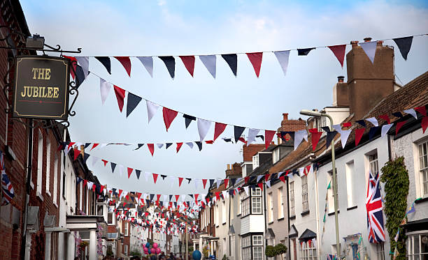 British Diamond Jubilee Street Party An English street decorated with flags and bunting to celebrate the Queen's Jubilee in 2012.  The sign has been created by the photographer and the words "The Jubilee" could be changed quite easily. british flag photos stock pictures, royalty-free photos & images
