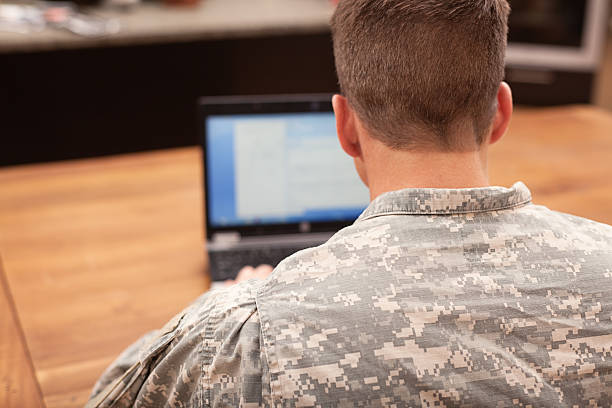 istock American soldier working on laptop 155385499
