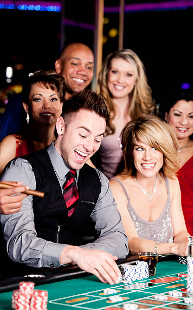 istock Group of happy diverse people at the blackjack table 155385611