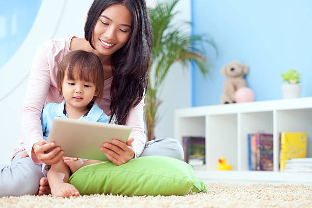 Watching Cartoons on Tablet Pc stock photo